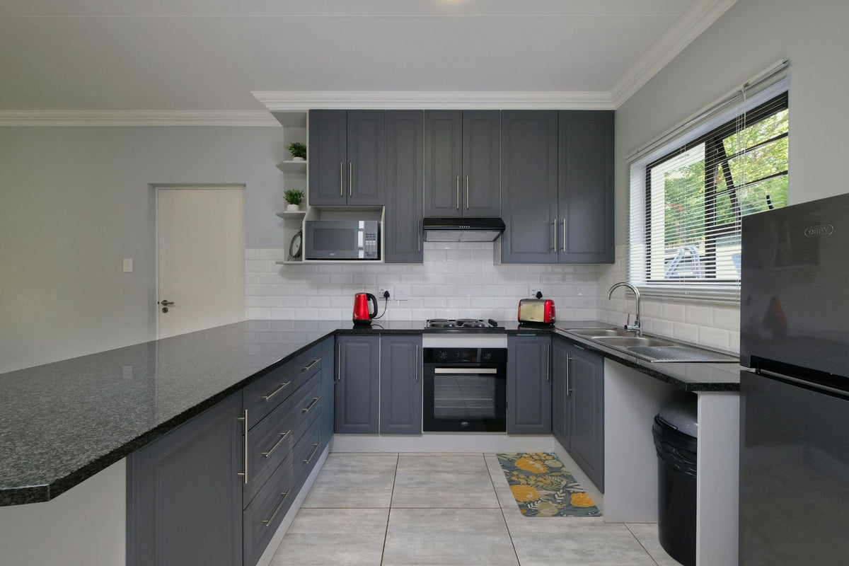 glass splashback grey kitchen