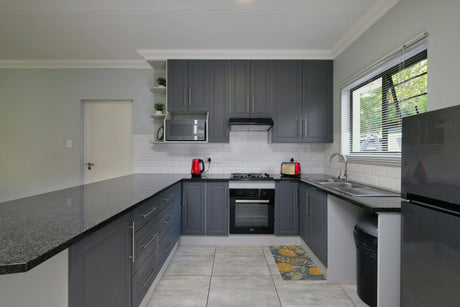 glass splashback grey kitchen