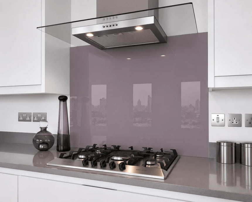 Dark thistle purple glass splashback behind hob